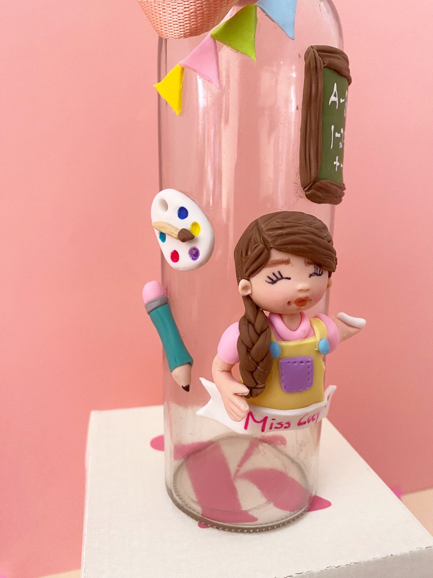Botella de vidrio para maestra