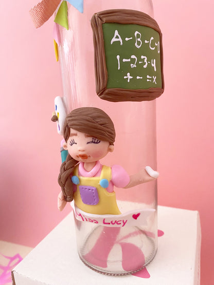 Botella de vidrio para maestra